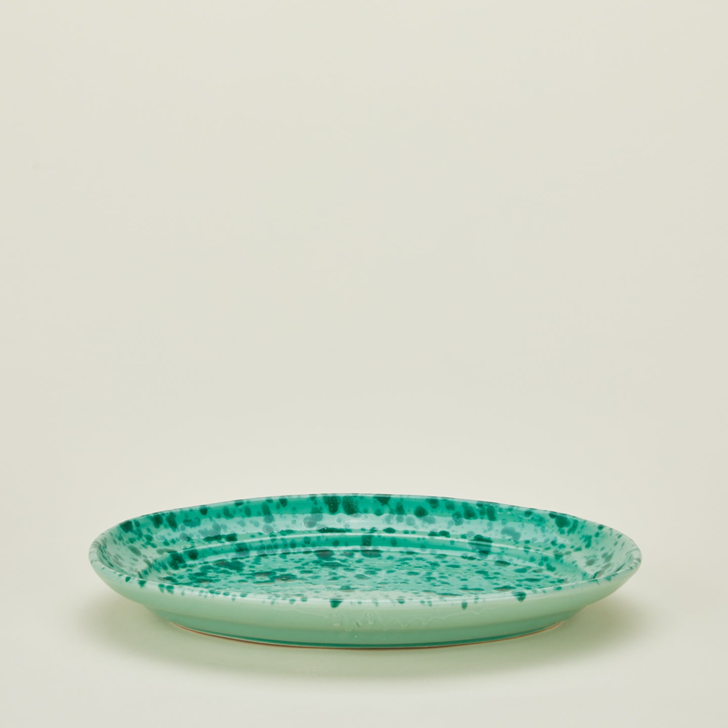 Splatterware serving platter in sage and green