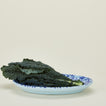 Splatterware serving platter in sky and cobalt with lettuce