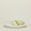Splatterware serving platter in white and ivory with lettuce