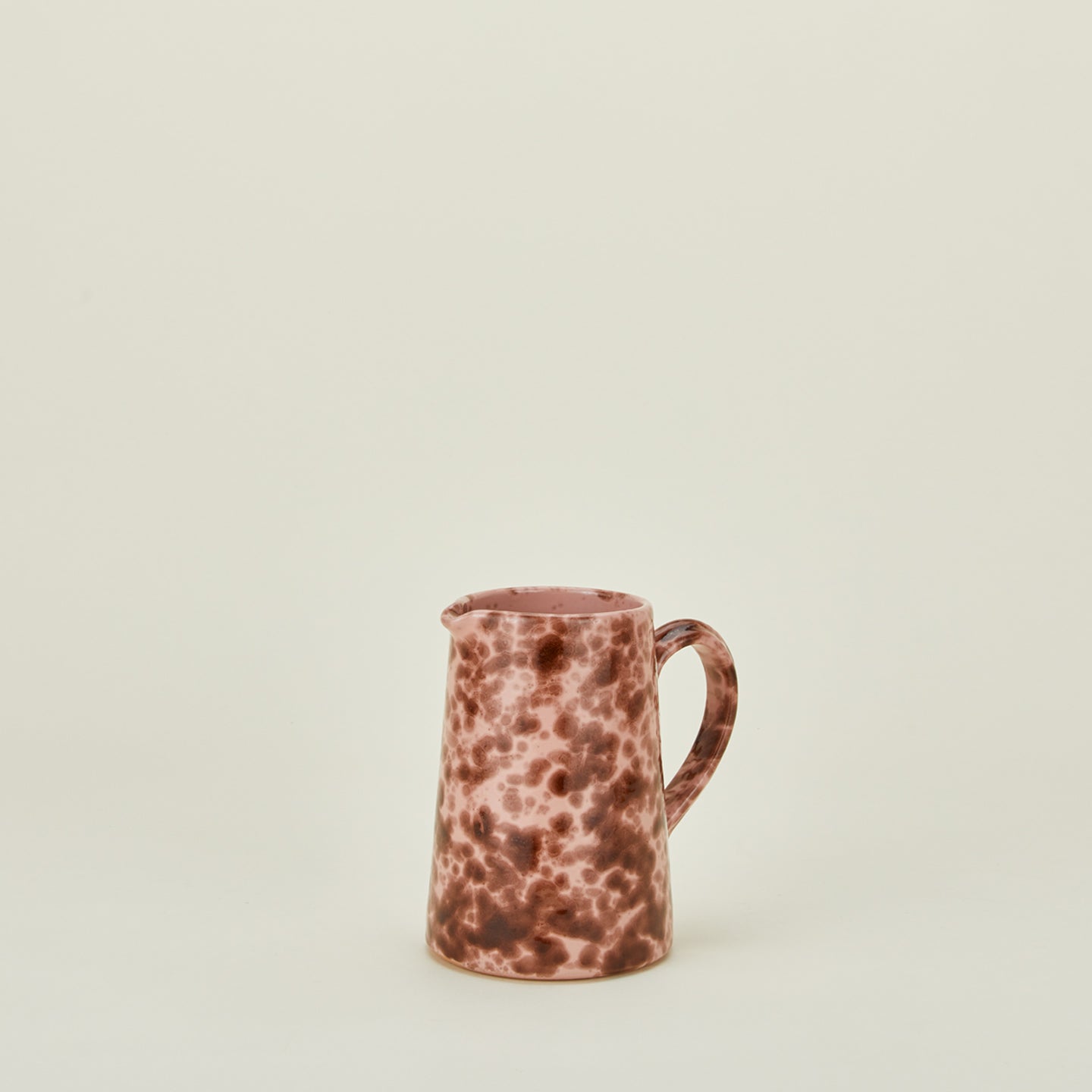 Small splatterware pitcher in blush and terracotta
