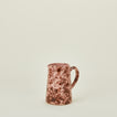 Small splatterware pitcher in blush and terracotta