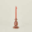 Small splatterware candlestick holder in blush and terracotta with candle
