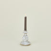 Small splatterware candlestick in white and grey with candle
