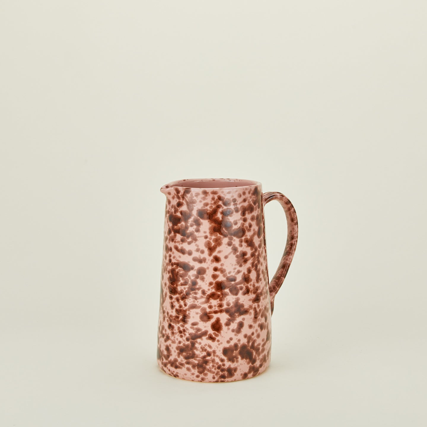Large splatterware pitcher in blush and terracotta