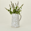 Large splatterware pitcher in white and grey with florals