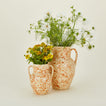 Large and small splatterware vases in ivory and bronze with florals