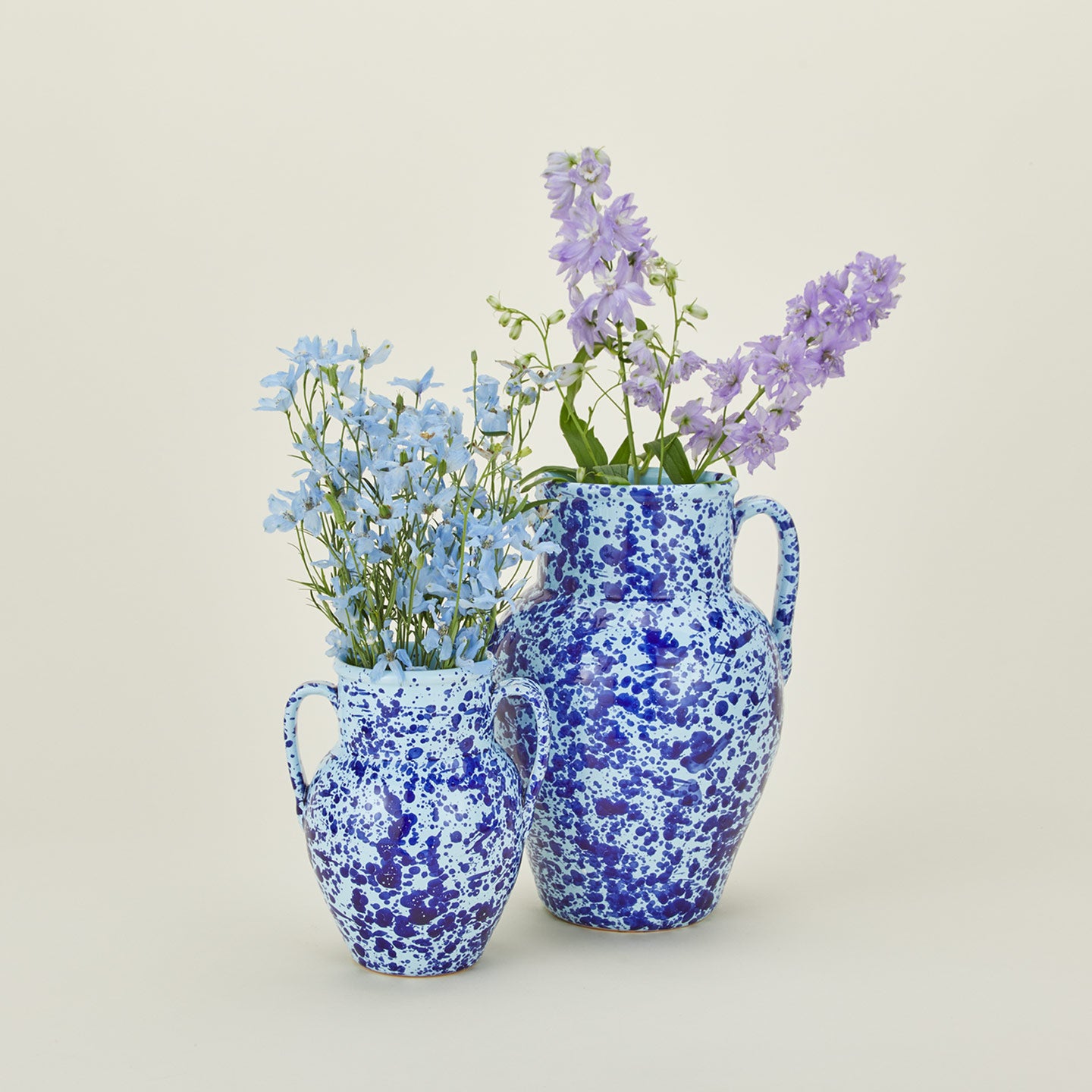 Large and small splatter ware vases in sky and cobalt with florals