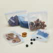 Silicone sandwich bags in three sizes with food.