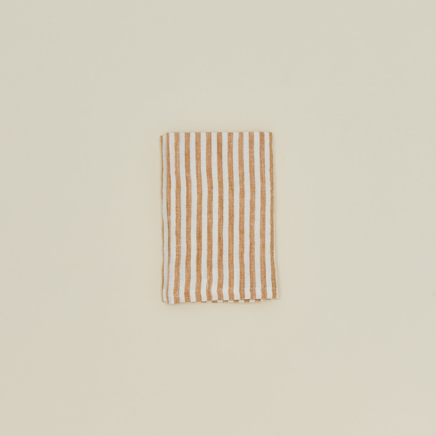 Tell Me More leon striped napkin folded.