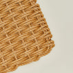 Close up view of woven doormat in honey
