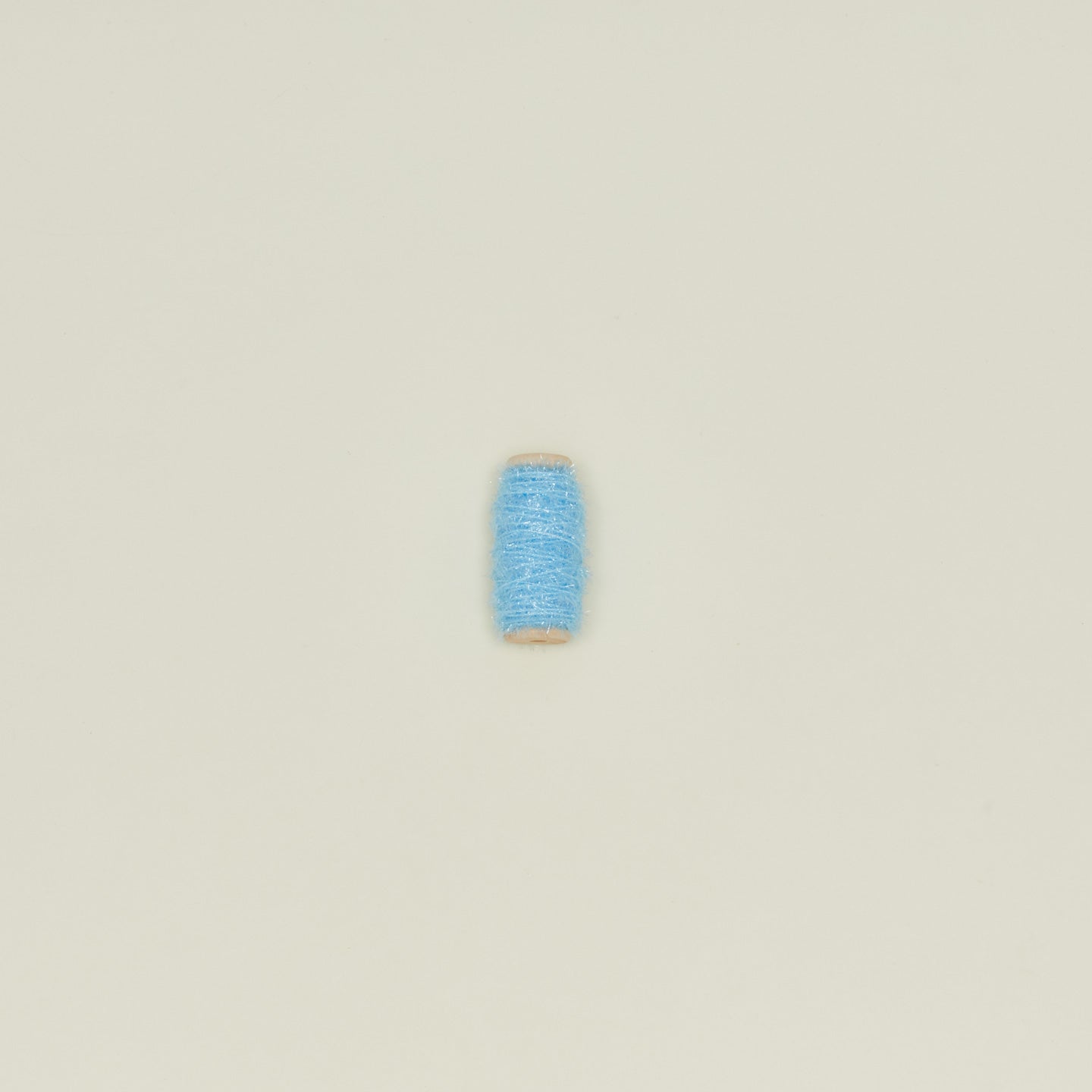 Tinsel ribbon in sky on neutral background