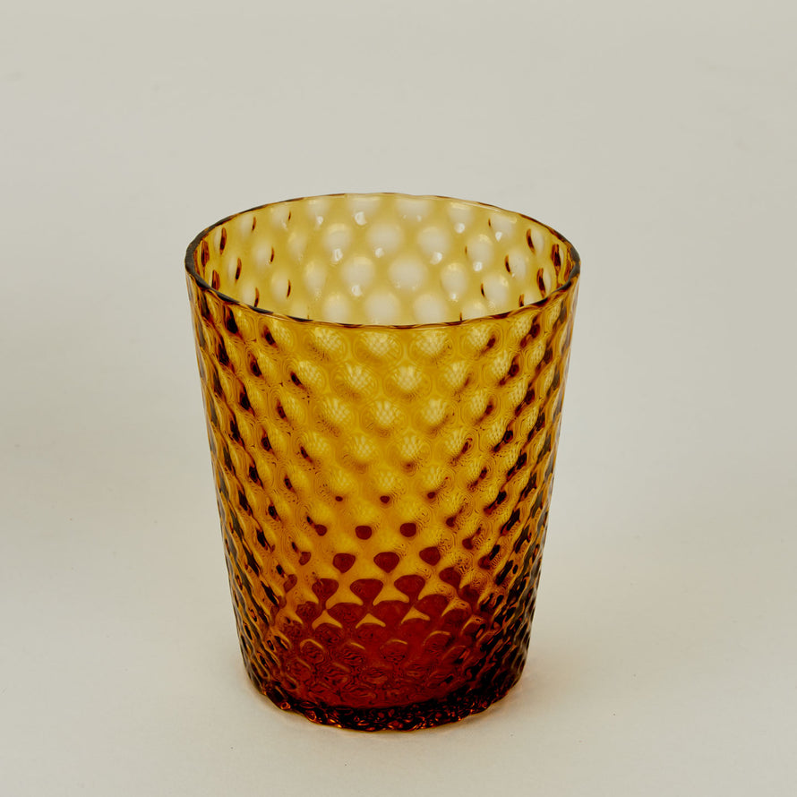 Close up of Veneziano Tumbler in Amber.