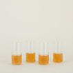 Four clear Simple Glasses in Tall size filled with sparkling wine.