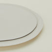 Close up of Atelier Dinner Plate and Atelier Salad Plate stacked.