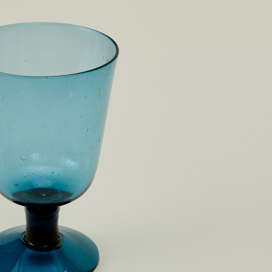 Close up of Stemmed Wine Glass in Peacock.