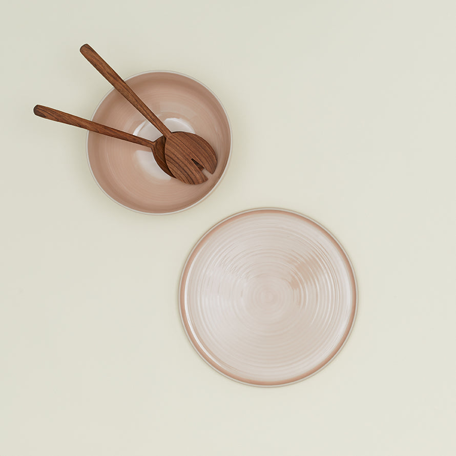 Essential Serving Bowl and Serving Platter in Blush, with wood serving utensils.